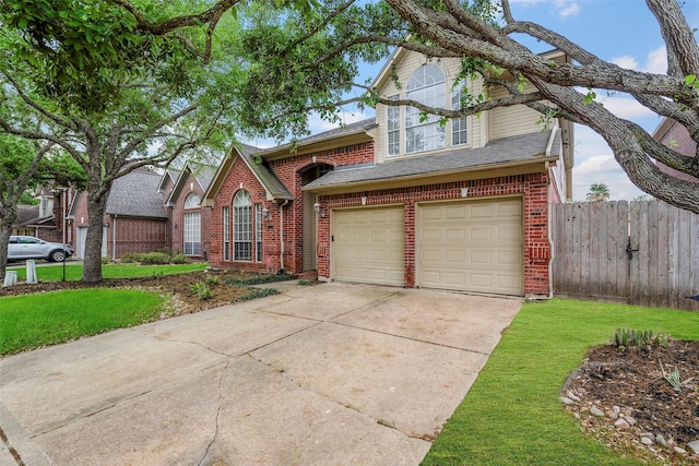 1123 Misty Lake Dr, Sugar Land, TX 77498 - traditional-style house featuring brick siding, concrete driveway, a garage, and roof with shingles