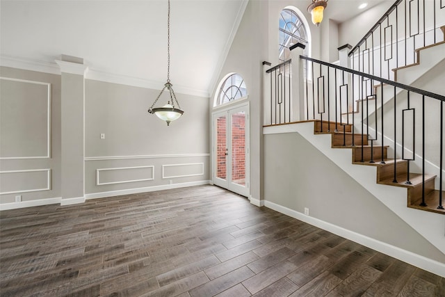 1123 Misty Lake Dr, Sugar Land, TX 77498 - stairs with a high ceiling, wood finished floors, and ornamental molding