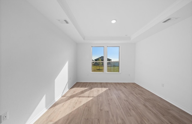 31727 Valor Dr, Fulshear, TX 77441 - unfurnished room with a tray ceiling, wood finished floors, and recessed lighting