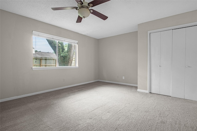 15814 Brookford Dr, Houston, TX 77059 - unfurnished bedroom featuring carpet, a closet, a ceiling fan, and a textured ceiling