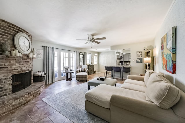 1721 Bowline Rd, Houston, TX 77062 - tiled living area featuring a ceiling fan and a fireplace