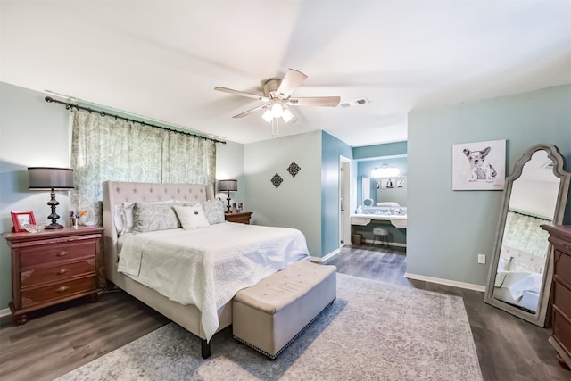 1721 Bowline Rd, Houston, TX 77062 - bedroom with dark wood-style flooring, a ceiling fan, and connected bathroom