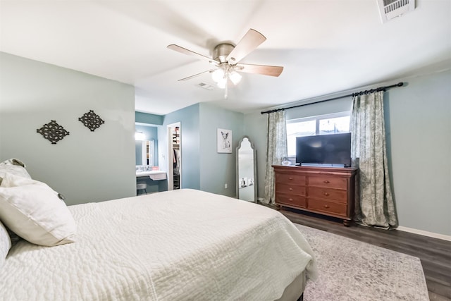 1721 Bowline Rd, Houston, TX 77062 - bedroom featuring dark wood-type flooring, a ceiling fan, and a spacious closet