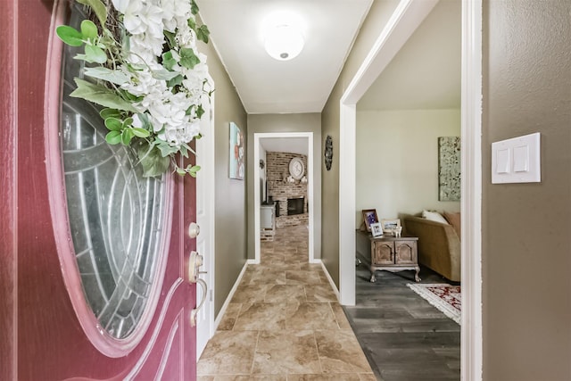 1721 Bowline Rd, Houston, TX 77062 - entryway featuring baseboards and a brick fireplace