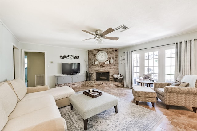 1721 Bowline Rd, Houston, TX 77062 - living room with ceiling fan, light tile patterned floors, and a brick fireplace