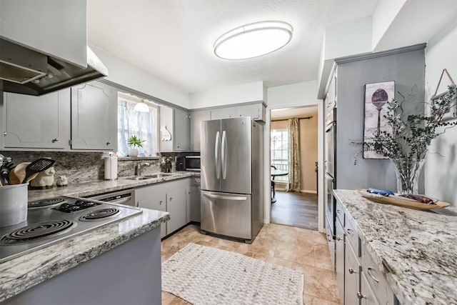 1721 Bowline Rd, Houston, TX 77062 - kitchen featuring stainless steel appliances, gray cabinets, and healthy amount of natural light