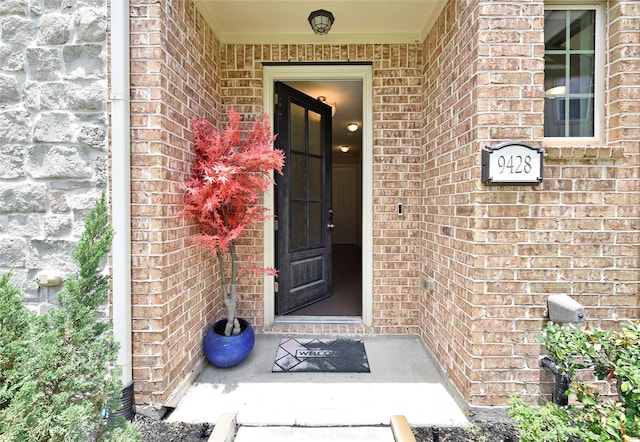 9428 Caddo Ridge Ln, Cypress, TX 77433 - doorway to property with brick siding