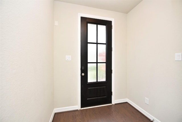 9428 Caddo Ridge Ln, Cypress, TX 77433 - entryway featuring dark wood-style flooring and baseboards