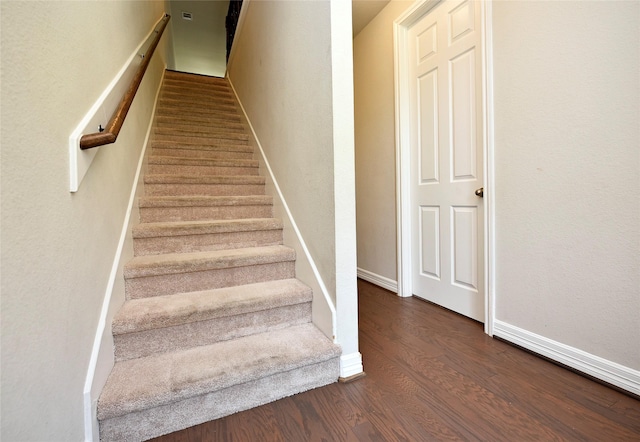 9428 Caddo Ridge Ln, Cypress, TX 77433 - staircase with wood finished floors and baseboards