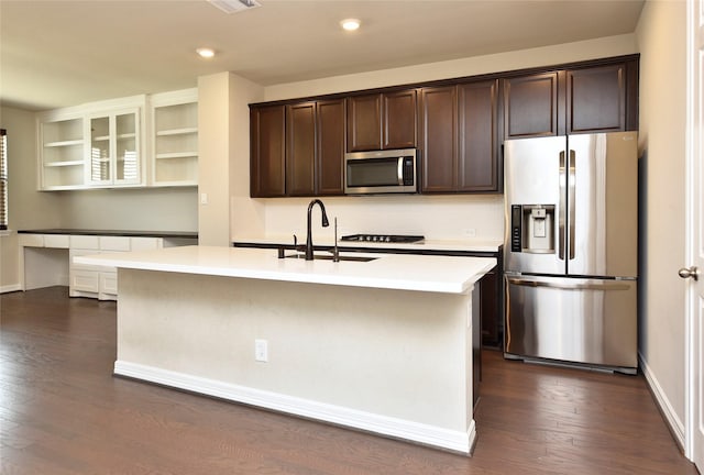 9428 Caddo Ridge Ln, Cypress, TX 77433 - kitchen featuring appliances with stainless steel finishes, dark brown cabinetry, light countertops, dark wood-style floors, and recessed lighting
