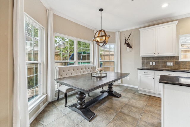 1440 Waseca St, Houston, TX 77055 - dining area with plenty of natural light, a chandelier, breakfast area, and crown molding