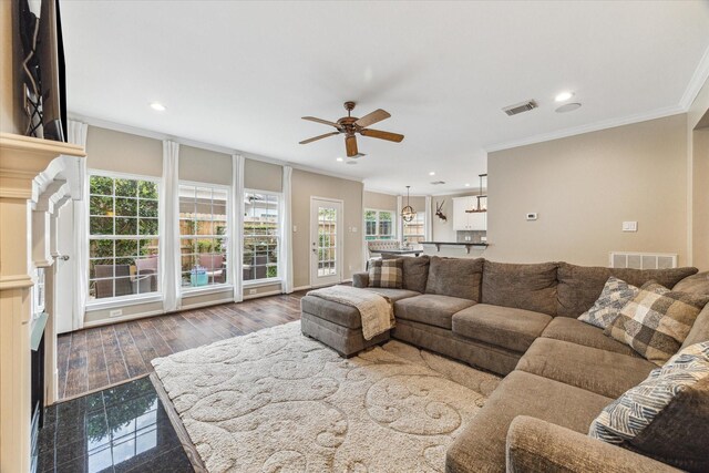 1440 Waseca St, Houston, TX 77055 - living room featuring crown molding, a ceiling fan, recessed lighting, and wood finished floors