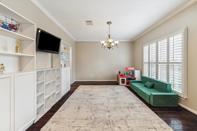 1440 Waseca St, Houston, TX 77055 - sitting room with crown molding, plenty of natural light, dark wood-type flooring, a chandelier, and built in shelves