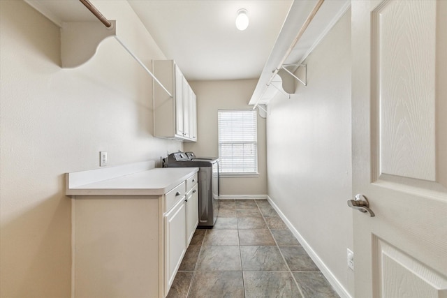 1440 Waseca St, Houston, TX 77055 - washroom with cabinet space, stone finish flooring, and separate washer and dryer