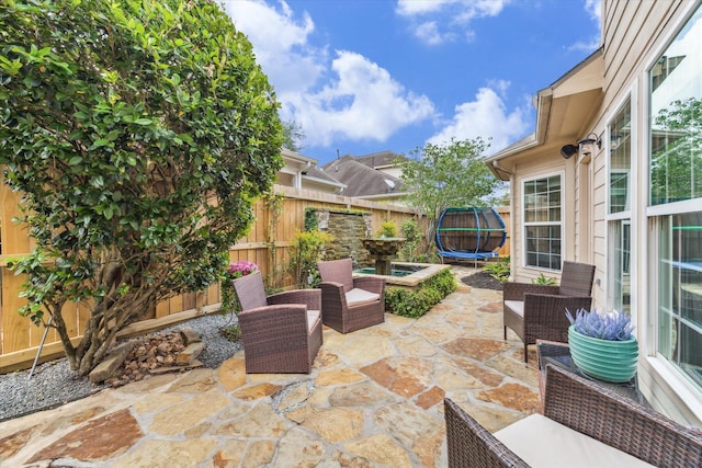 1440 Waseca St, Houston, TX 77055 - fenced backyard with a trampoline and a patio area