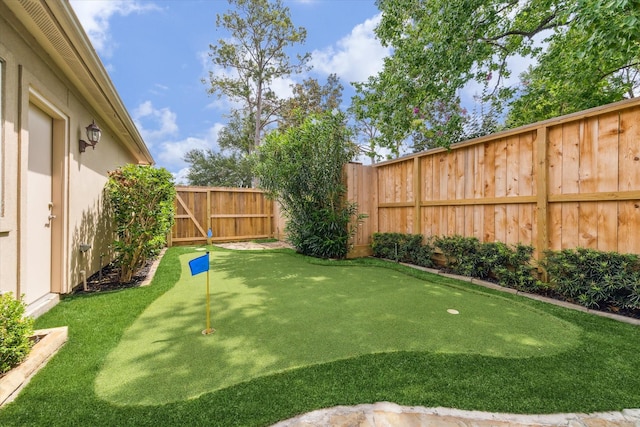 1440 Waseca St, Houston, TX 77055 - fenced backyard featuring a putting area