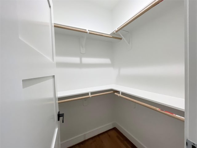 3038 Webster St, Houston, TX 77004 - walk in closet featuring dark wood-style flooring
