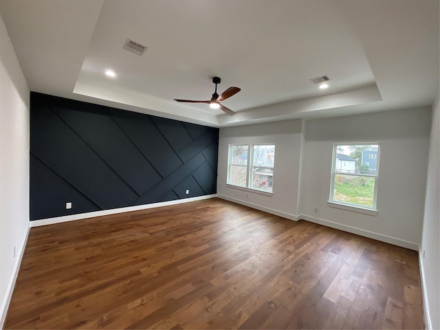 3038 Webster St, Houston, TX 77004 - unfurnished room with a tray ceiling, plenty of natural light, wood finished floors, a ceiling fan, and recessed lighting