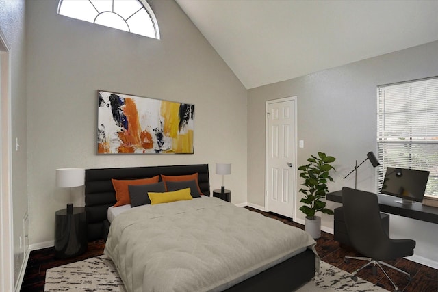 2300 Old Spanish Trl Unit 1128, Houston, TX 77054 - bedroom with high vaulted ceiling, multiple windows, and wood finished floors