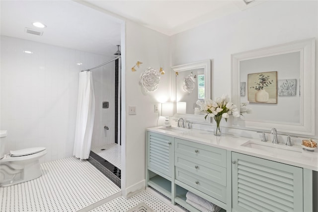 8220 Wateka Cir, Houston, TX 77074 - bathroom with a tile shower, double vanity, and tile patterned floors