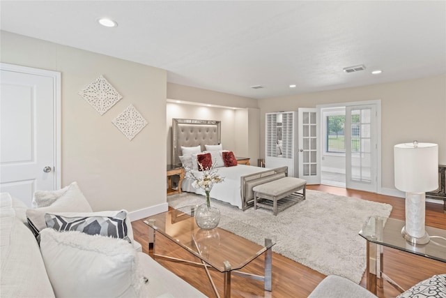 8220 Wateka Cir, Houston, TX 77074 - bedroom featuring wood finished floors, recessed lighting, and french doors