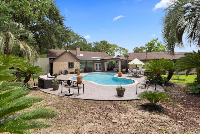 8220 Wateka Cir, Houston, TX 77074 - swimming pool featuring french doors, a patio area, and an outdoor hangout area