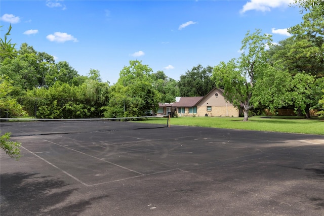 8220 Wateka Cir, Houston, TX 77074 - view of tennis court with a lawn