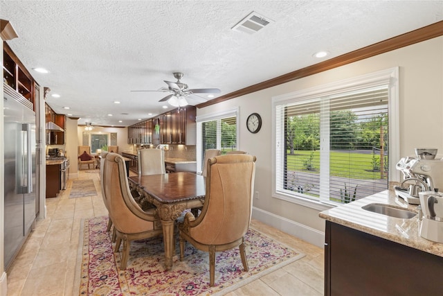 8220 Wateka Cir, Houston, TX 77074 - dining room with a ceiling fan, ornamental molding, a textured ceiling, recessed lighting, and light tile patterned floors