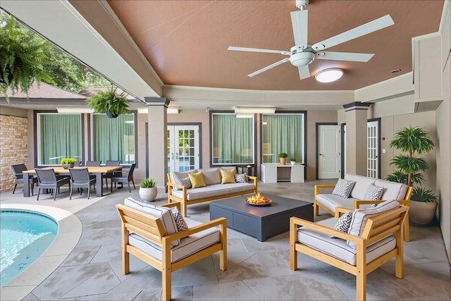 8220 Wateka Cir, Houston, TX 77074 - view of patio with an outdoor living space with a fire pit, an outdoor pool, a ceiling fan, and outdoor dining space