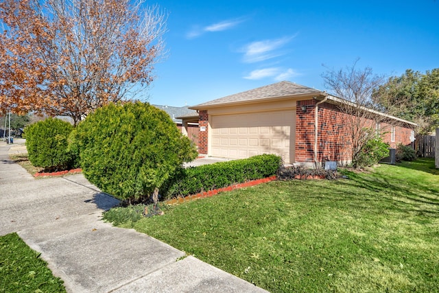 9710 Golden Park Ln, Houston, TX 77088 - view of side of property featuring brick siding, a garage, and a yard