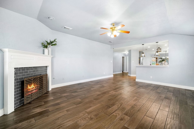 9710 Golden Park Ln, Houston, TX 77088 - unfurnished living room with a tile fireplace, dark wood-style floors, a ceiling fan, and lofted ceiling