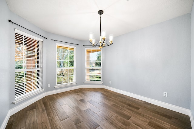 9710 Golden Park Ln, Houston, TX 77088 - empty room featuring a chandelier and dark wood-type flooring