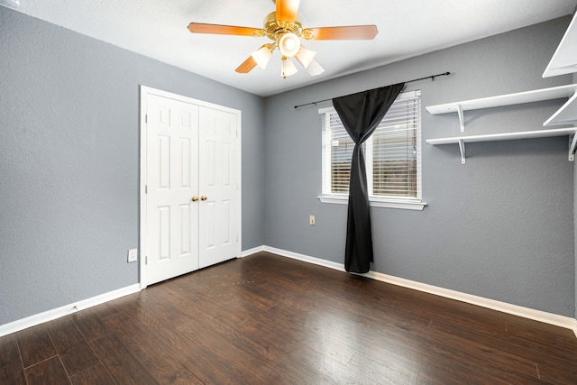 9710 Golden Park Ln, Houston, TX 77088 - unfurnished bedroom featuring dark wood finished floors, a closet, and a ceiling fan
