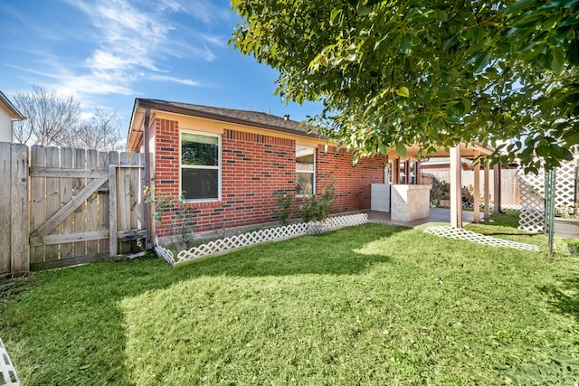 9710 Golden Park Ln, Houston, TX 77088 - rear view of property with brick siding, a patio area, and a gate