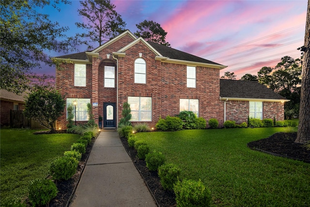 16206 Lakewood Field Dr, Tomball, TX 77377 - view of front of house with a lawn, brick siding, and roof with shingles