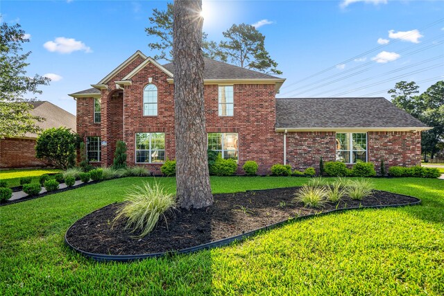 16206 Lakewood Field Dr, Tomball, TX 77377 - view of front of home with a front lawn, brick siding, and a shingled roof