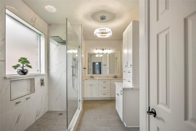 16206 Lakewood Field Dr, Tomball, TX 77377 - full bathroom featuring a marble finish shower, vanity, a chandelier, and tile patterned floors