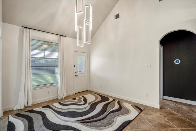 16206 Lakewood Field Dr, Tomball, TX 77377 - foyer entrance featuring high vaulted ceiling, tile patterned flooring, and arched walkways