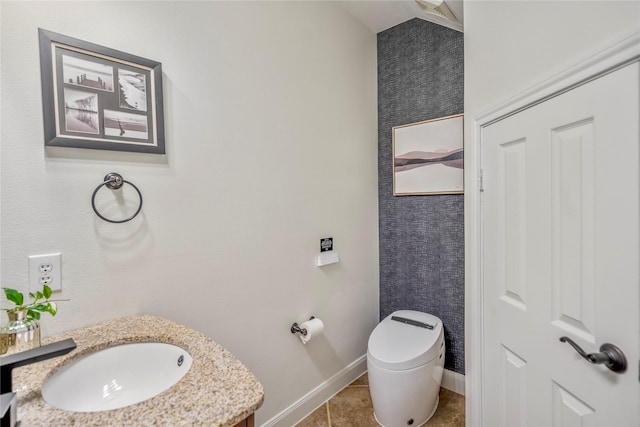 16206 Lakewood Field Dr, Tomball, TX 77377 - bathroom featuring lofted ceiling, vanity, and tile patterned flooring