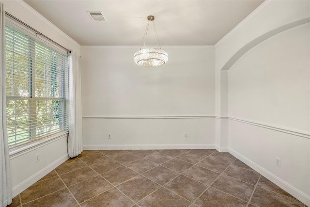 16206 Lakewood Field Dr, Tomball, TX 77377 - spare room with a chandelier, dark tile patterned flooring, and ornamental molding