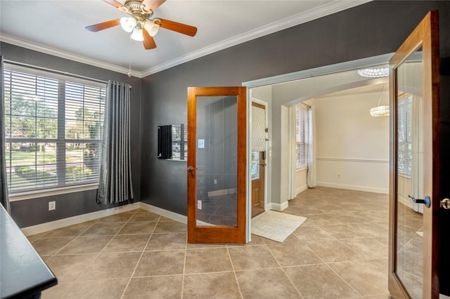 16206 Lakewood Field Dr, Tomball, TX 77377 - spare room with french doors, arched walkways, light tile patterned floors, crown molding, and a ceiling fan