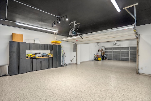16206 Lakewood Field Dr, Tomball, TX 77377 - garage featuring a garage door opener