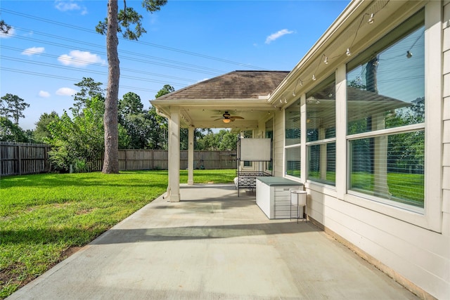 16206 Lakewood Field Dr, Tomball, TX 77377 - fenced backyard with ceiling fan and a patio