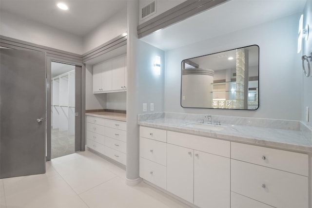 5110 Contour Pl, Houston, TX 77096 - bathroom featuring vanity, tile patterned flooring, a spacious closet, and recessed lighting