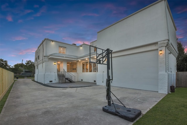 5110 Contour Pl, Houston, TX 77096 - view of front facade featuring driveway, a garage, stucco siding, and a metal roof