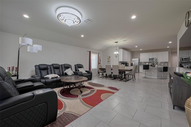 29626 Weber Way Ct, Katy, TX 77494 - living room with a chandelier, recessed lighting, and light tile patterned flooring