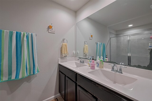 29626 Weber Way Ct, Katy, TX 77494 - full bathroom featuring double vanity, a shower stall, and recessed lighting