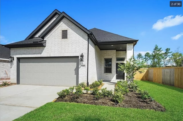 120 Lukewood Cir, Conroe, TX 77318 - view of front of home with brick siding, driveway, a garage, and a shingled roof