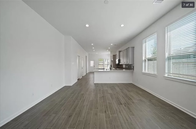 120 Lukewood Cir, Conroe, TX 77318 - unfurnished living room with dark wood finished floors and recessed lighting