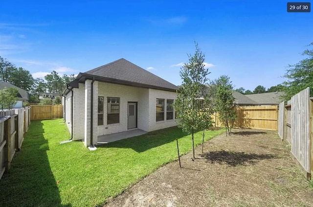 120 Lukewood Cir, Conroe, TX 77318 - rear view of property with brick siding, a fenced backyard, roof with shingles, and a patio
